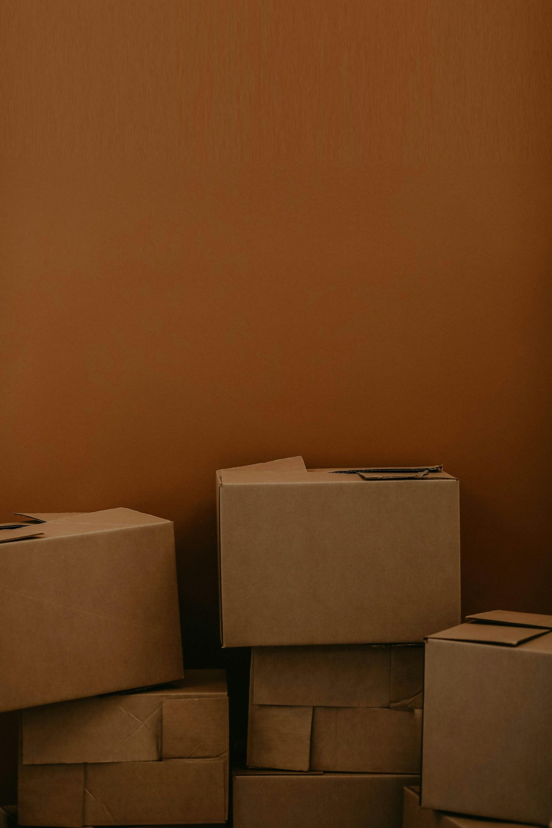 Neatly stacked cardboard moving boxes